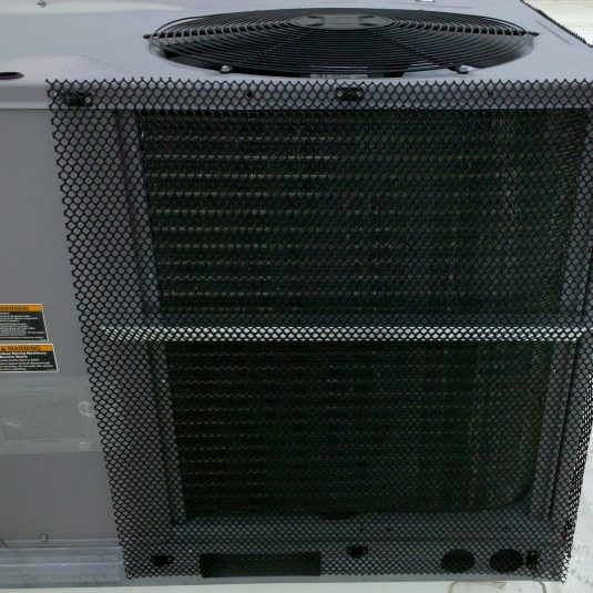 HailStop protective mesh installed on a rooftop HVAC condenser unit to prevent hail and debris damage