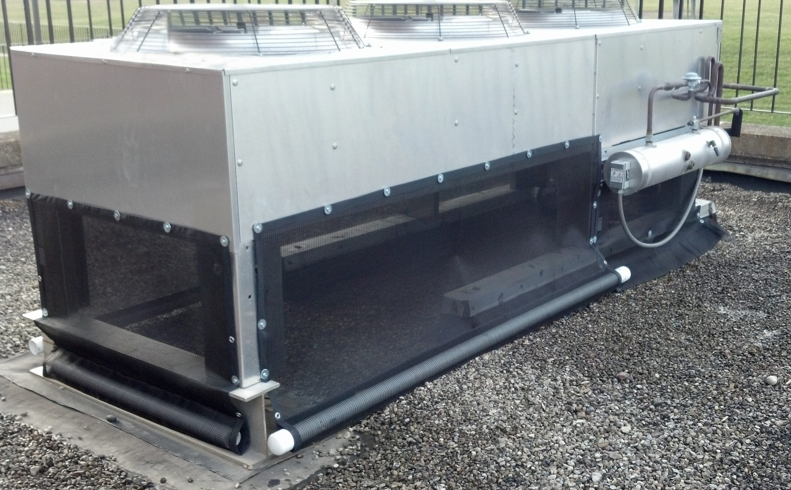 Liebert rooftop condenser unit protected with PreVent air intake screens and roll-up cleaning system
